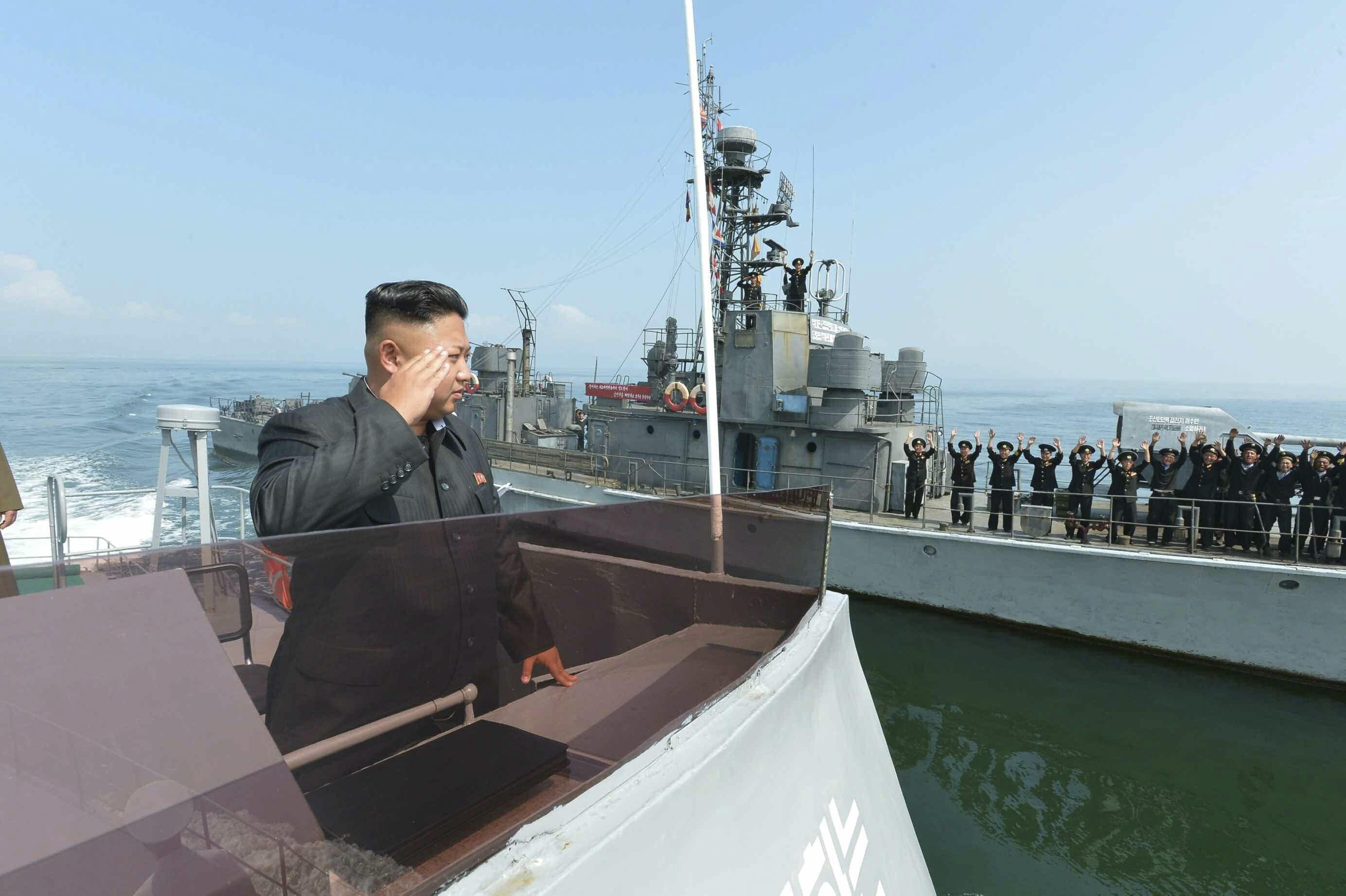 Image Kim Jong Un salutes during a landing drill of the Army Ground, Naval, Air and Anti-Air forces of the Korean People's Army (KPA) in this undated photo released by North Korea's Korean Central News Agency (KCNA) in Pyongyang July 5, 2014. 