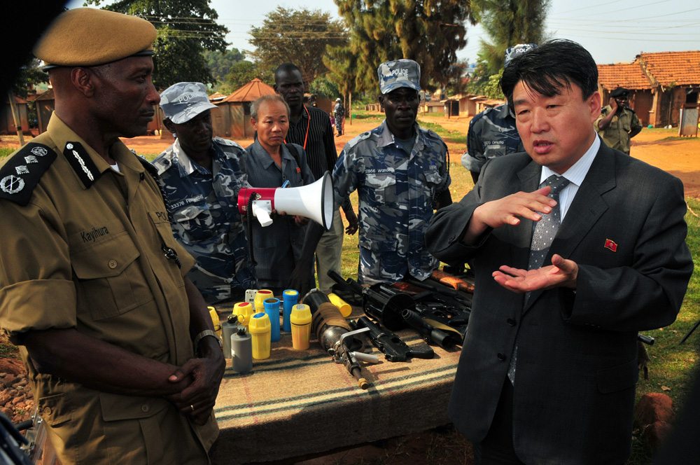 Image North Korean vice Minister of the the Ministry of Peoples Security, Mr. Ri Song, inspects weapons at a police training academy in Kampala, Uganda, June 13, 2013 (AFP/Stringer)