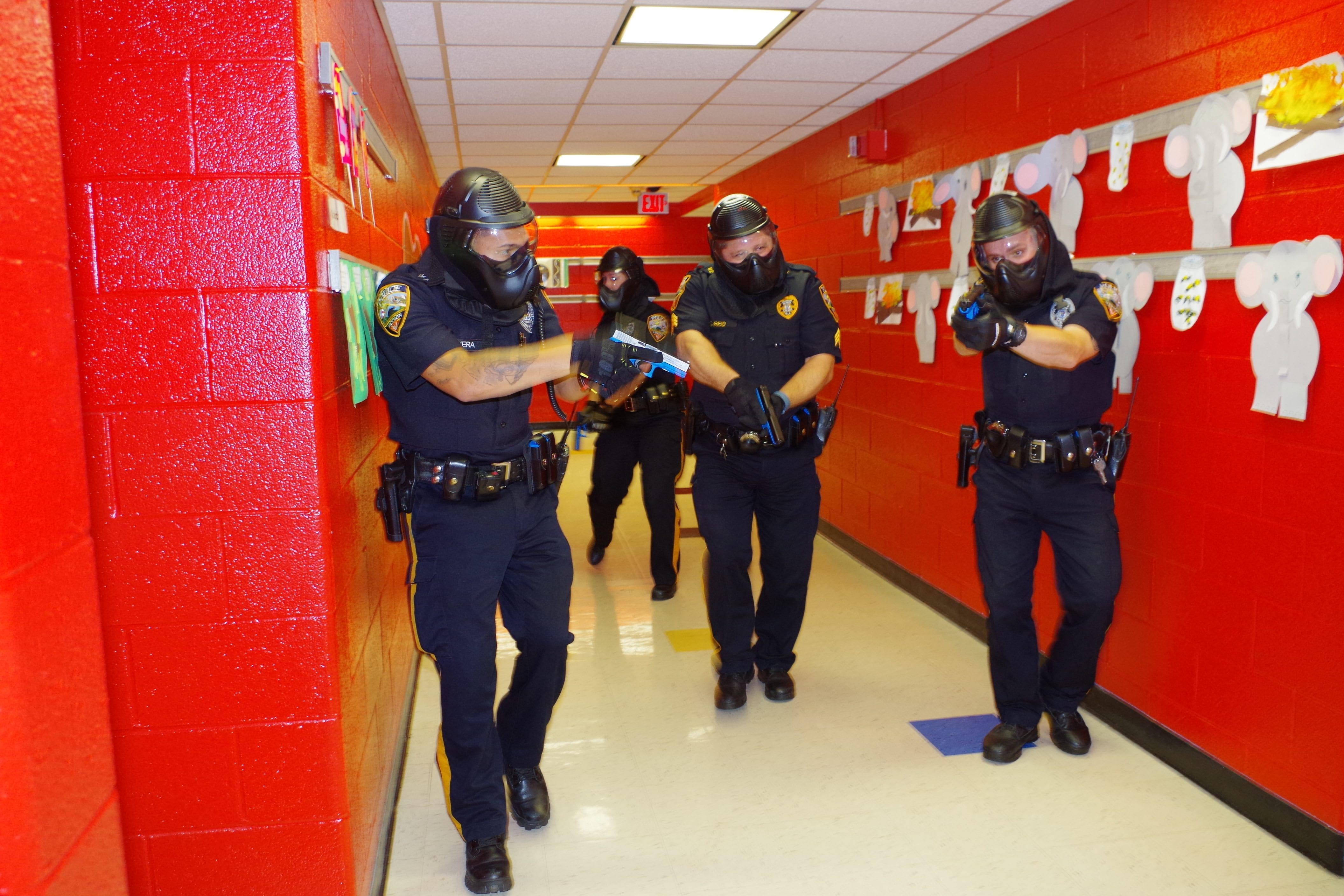 Image During an active shooter drill, four Vernon police officers go through Walnut Ridge Elementary School looking for three shooters (Photo by Chris Wyman).