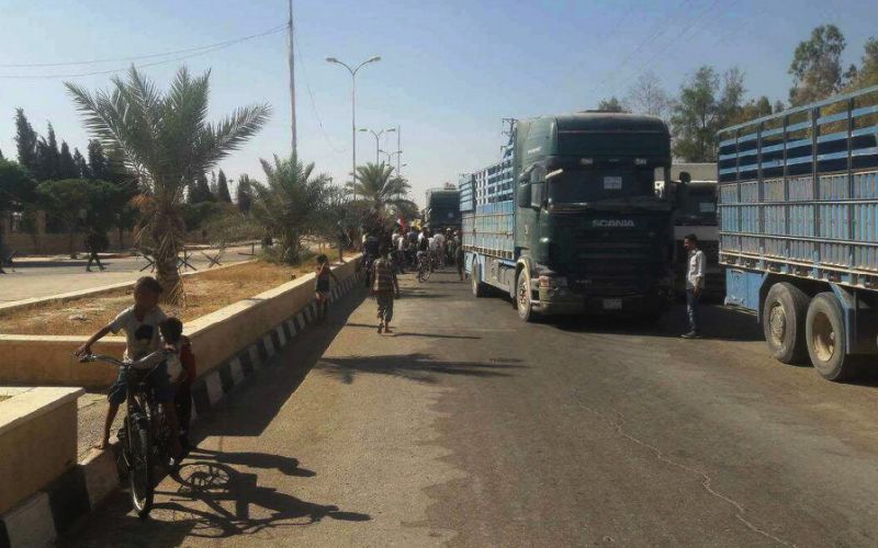 Image A handout picture released by the Syrian Arab News Agency (SANA) shows trucks carrying food aid arriving in Deir Ezzor on September 7, 2017, as the first supplies since government troops broke a jihadists siege were delivered (AFP Photo/HO)