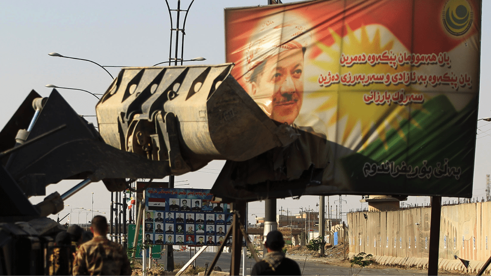 Image Iraqi forces use heavy equipment to damage a poster of Iraqi Kurdish President Massoud Barzani on the southern outskirts of Kirkuk, as Baghdad seeks to take control of the city from the Kurds. (AHMAD AL-RUBAYE / AFP)