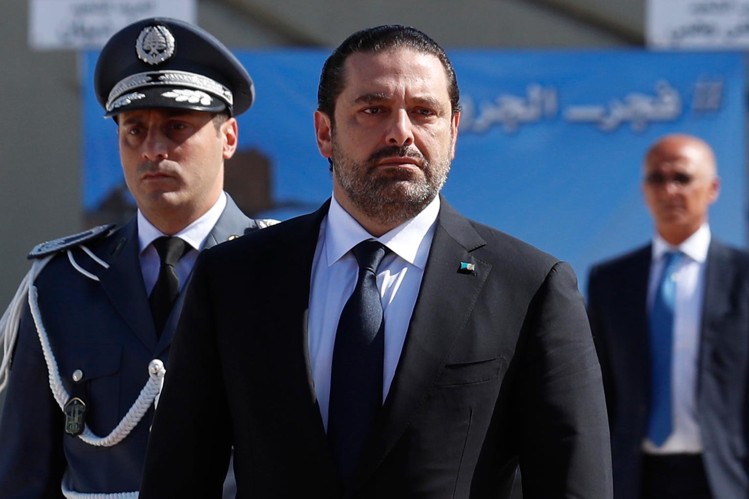 Image Lebanese Prime Minister Saad Hariri, left, arrives for a mass funeral of ten Lebanese soldiers at the Lebanese Defense Ministry, in Yarzeh near Beirut, Lebanon, Sept. 8, 2017 (Hassan Ammar/Associated Press)