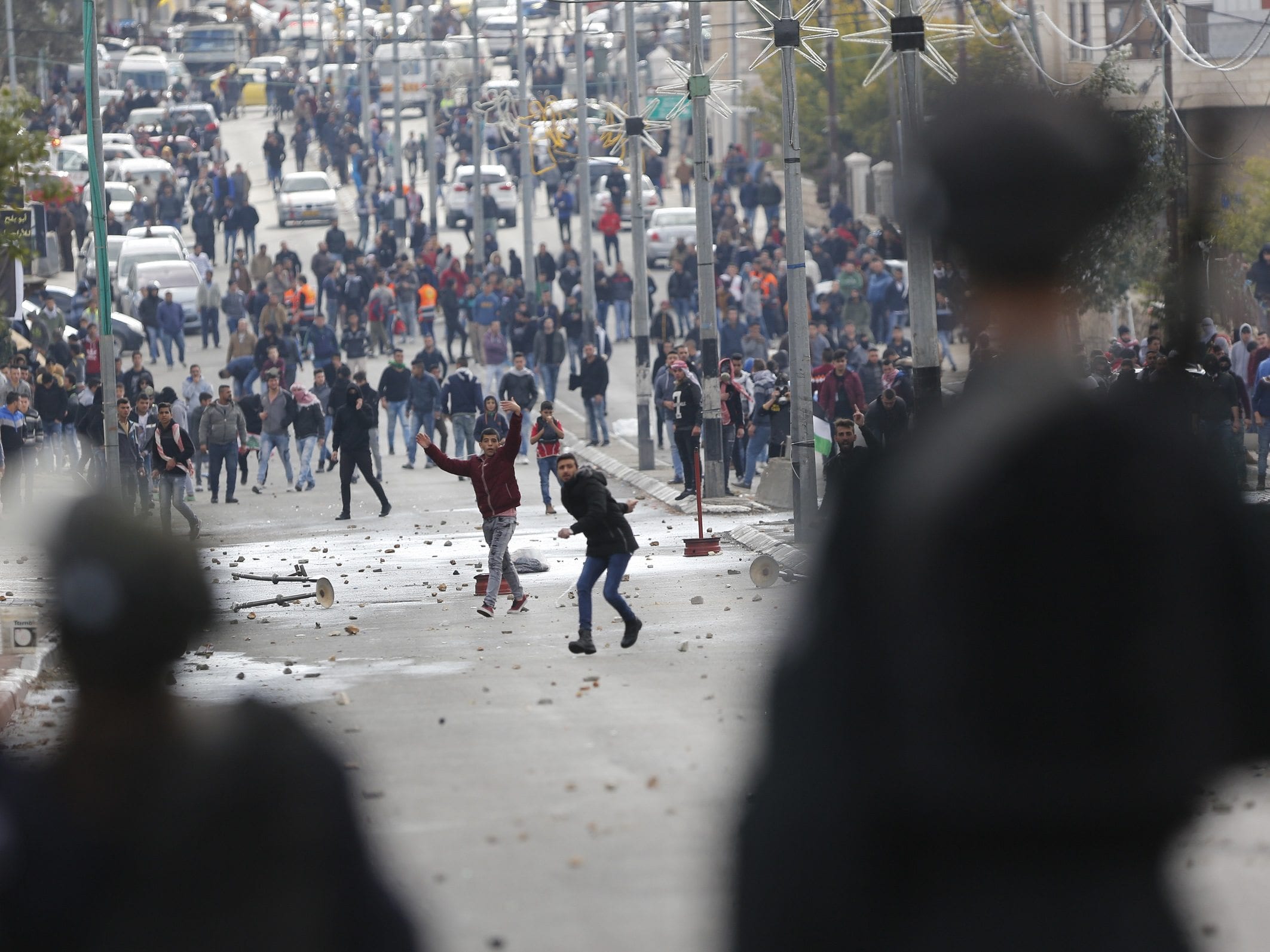 Image Palestinians clash with Israeli troops during a protest against U.S. President Donald Trump's decision to recognize Jerusalem as the capital of Israel in the West Bank city of Bethlehem, Thursday, Dec. 7, 2017.(AP Photo/Nasser Shiyoukhi)