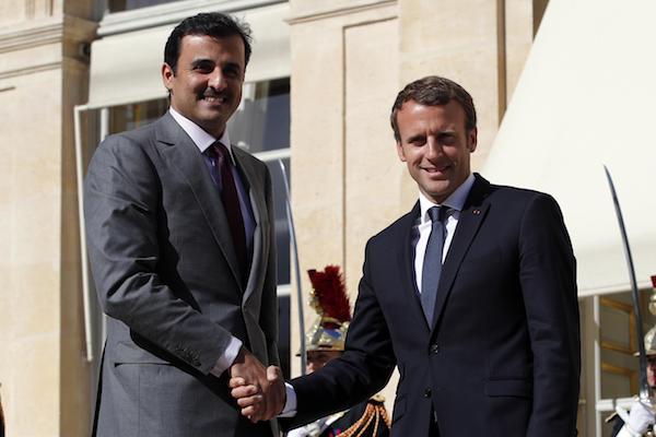 Image A defiant Qatar signs deals with France and UK amid blockade (AP Photo/Christophe Ena)