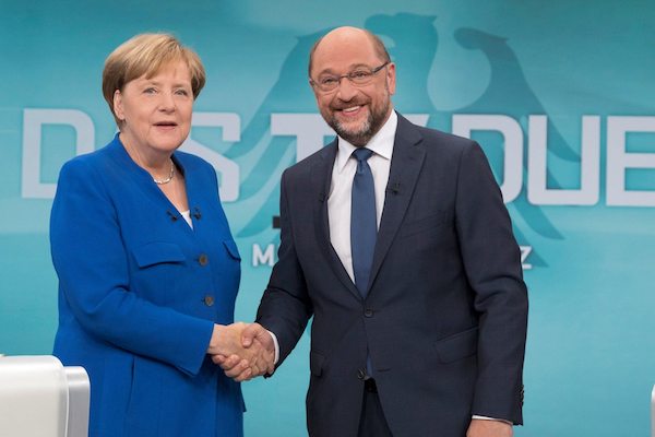 Title Image: German Chancellor Angela Merkel Martin Schulz shaking hands before their TV debate in Berlin in September. Photo: Reuters