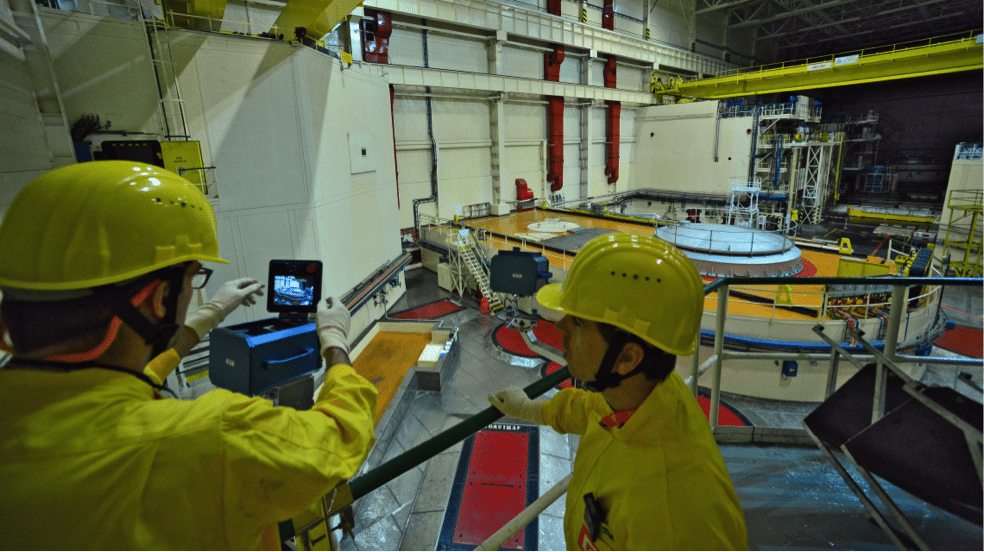 Image (IAEA Inspectors monitoring nuclear materials)