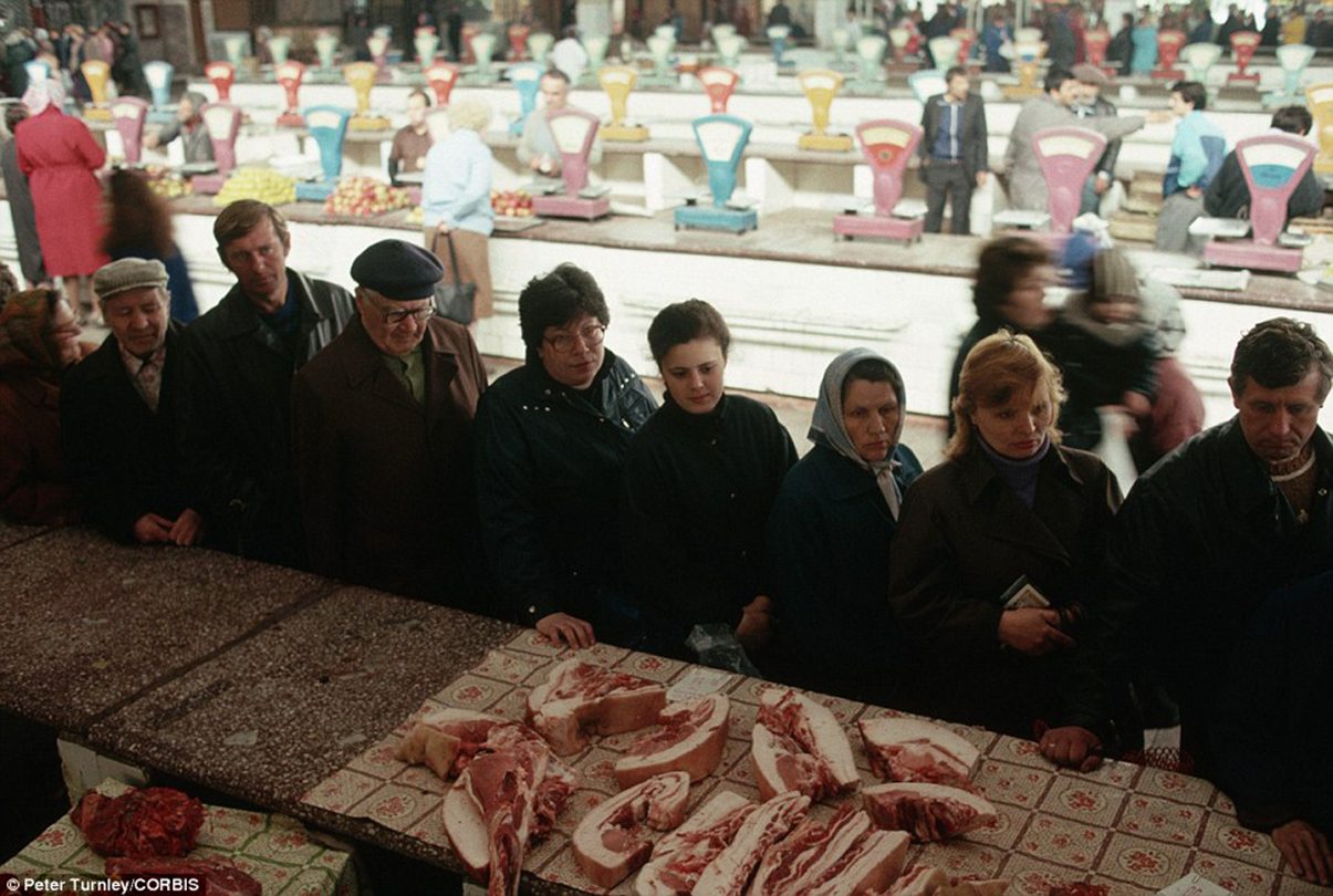 Image A long queue forms in Novokuznetsk for bacon and other meat from the butcher at a state-run market [Peter Turnley / Corbis]