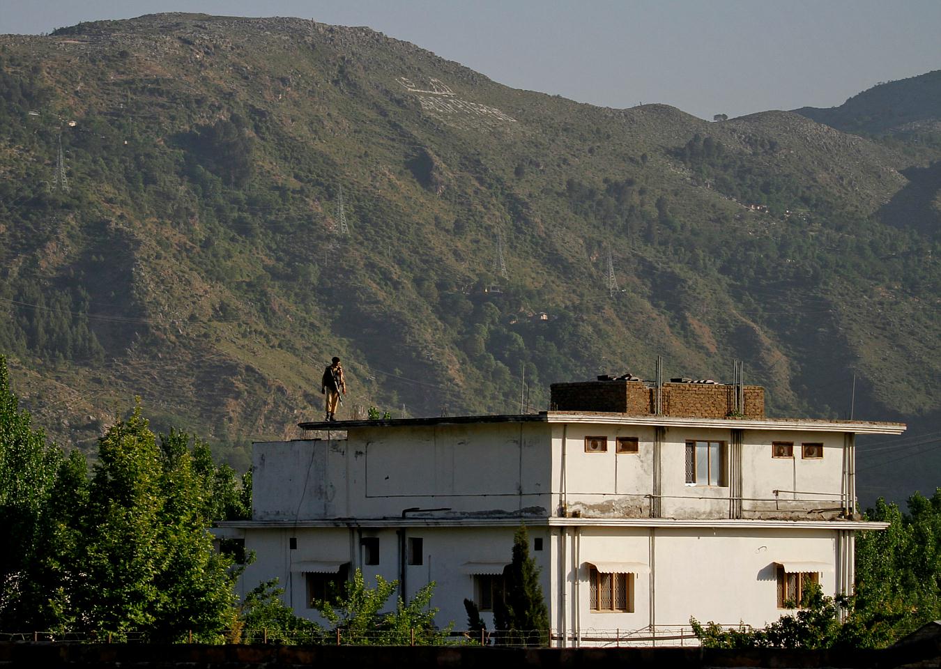 Image A Pakistani army soldier stands on the roof of the compound in Abbottabad, Monday, May 2, 2011. (AP Photo/Anjum Naveed)