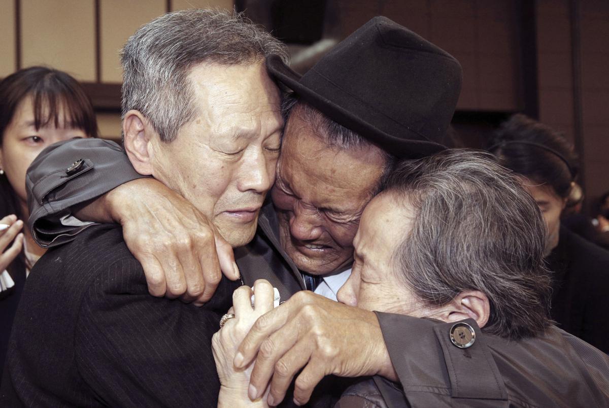 Image Oct. 22, 2015, North Korean Son Kwon Geun, center, weeps with his South Korean relatives as he bids farewell after the Separated Family Reunion Meeting at Diamond Mountain resort in North Korea (Korea Pool Photo via AP)