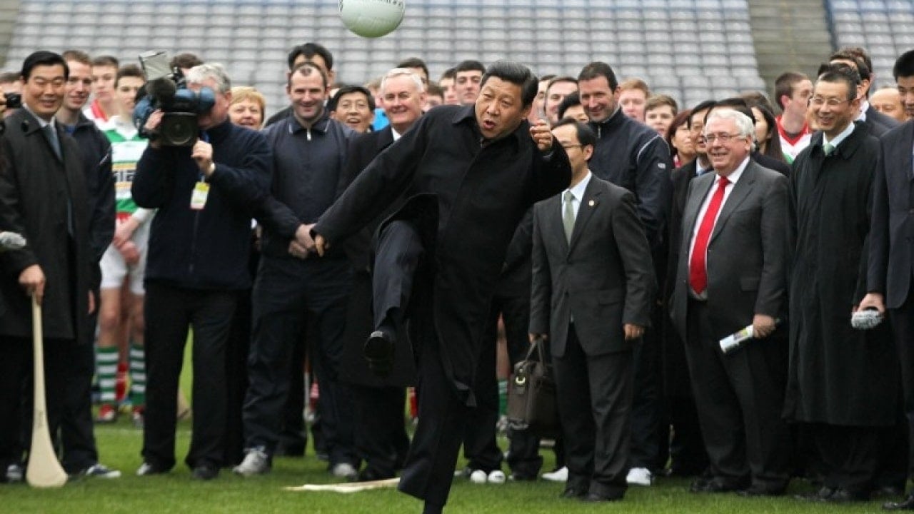 Image [Then Chinese Vice President Xi Jinping kicks a Gaelic football as he visits at Croke Park in Dublin, Ireland, February 19, 2012. (PETER MUHLY/AFP)]