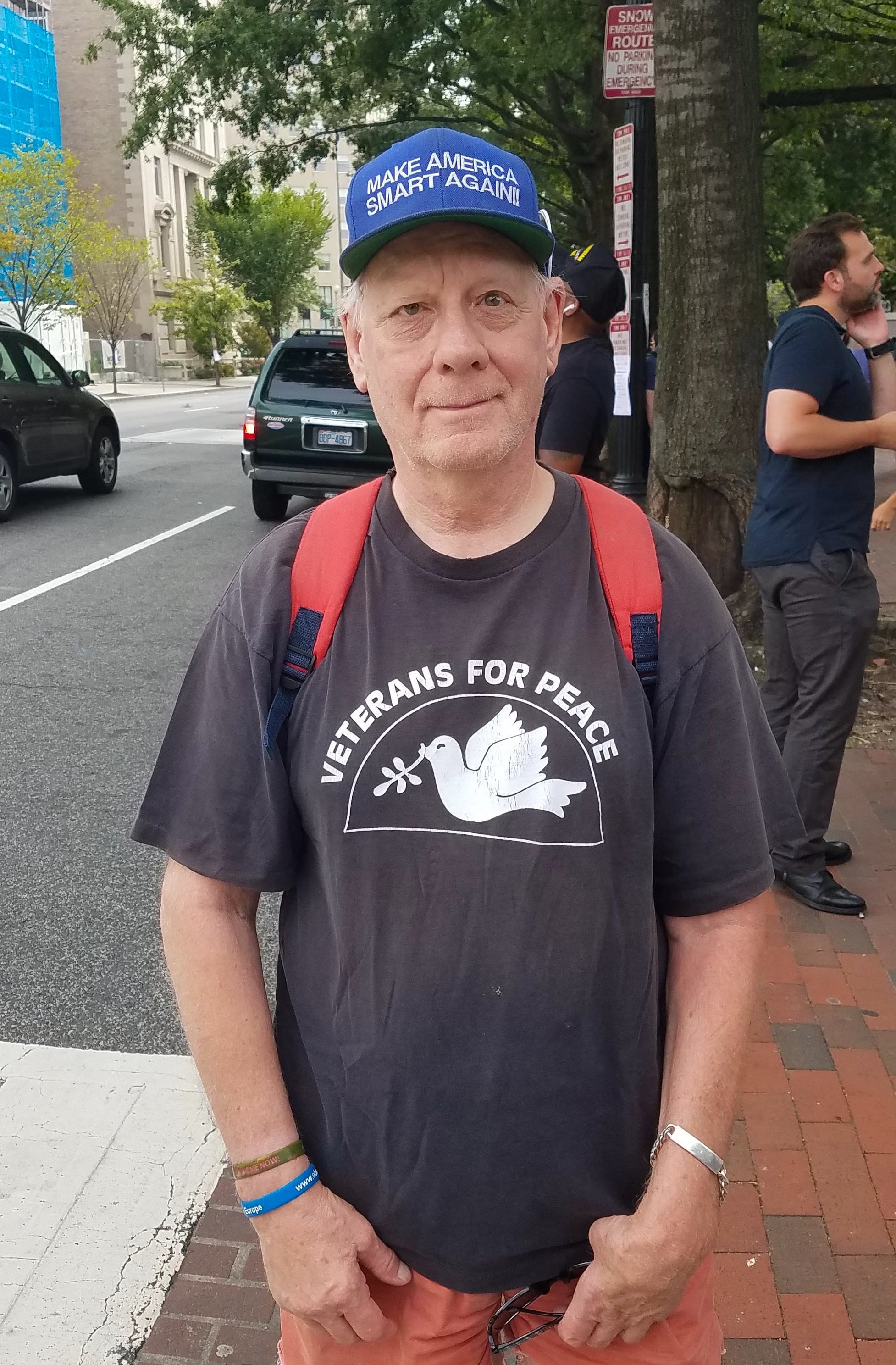 Image [Michael Marceau, President of Veterans for Peace, an Army combat veteran who was critically injured in Vietnam, came to protest at the Unite the Right 2 rally, Washington D.C., August 12, 2018][Photo: Alex Kish]