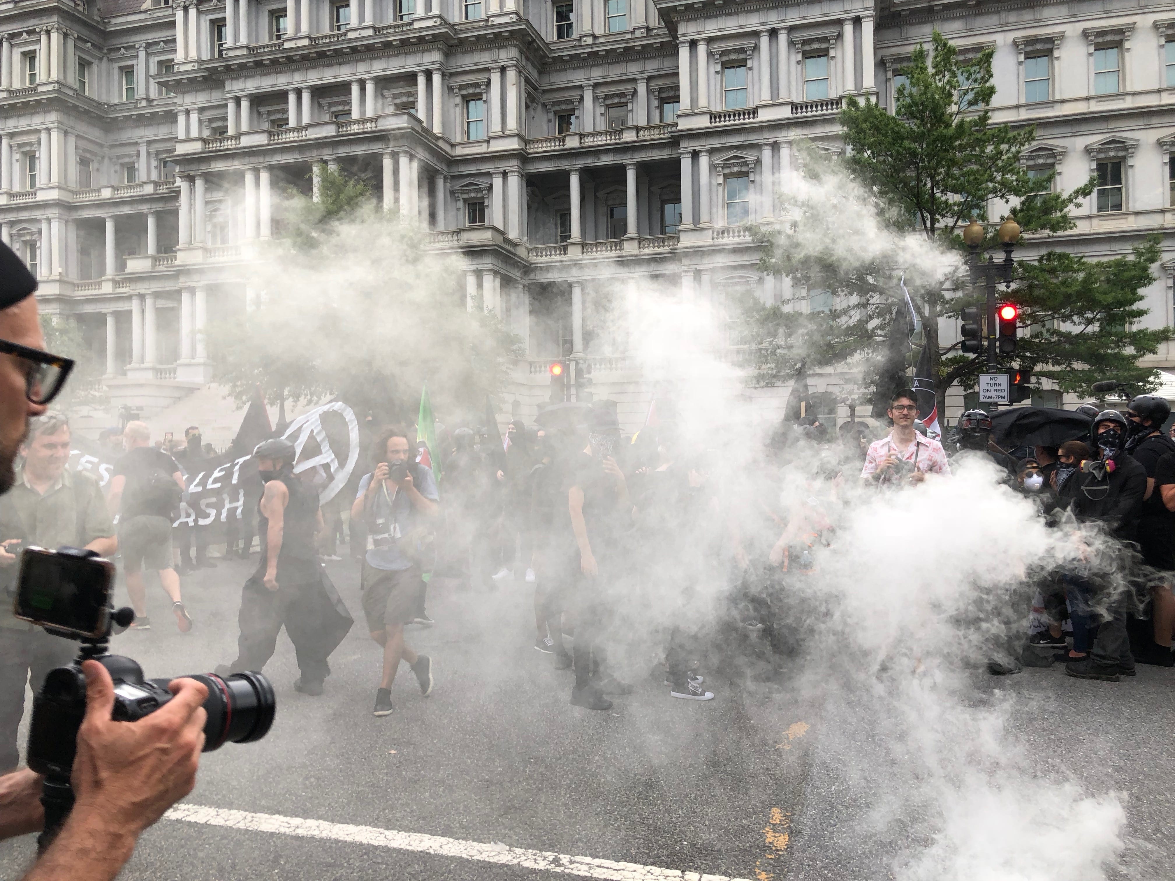 Image [A smoke bomb is thrown into counter-protest, Unite the Right 2 rally, Washington, D.C., August 12, 2018][Photo: Anthony A. LoPresti / Lima Charlie News]