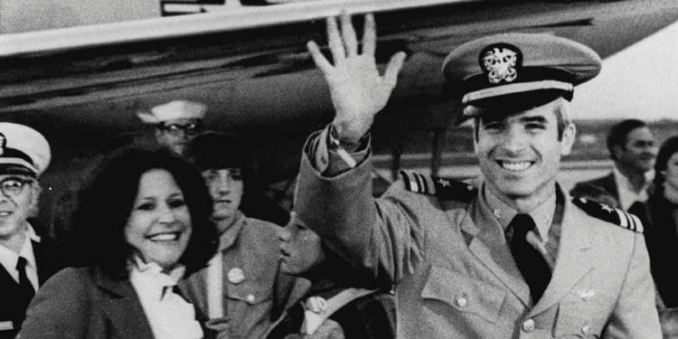 Image [Then Lt. Cdr. John S. McCain III, a POW for over five years, waves to well wishers after arriving at Jacksonville Naval Air Station in Florida in this March 18, 1973][AP Photo]