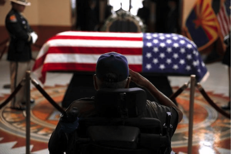 Image [Former serviceman saluting McCain’s casket at the memorial service in the Arizona state capitol. AP Photo / Jae C. Hong, Pool]