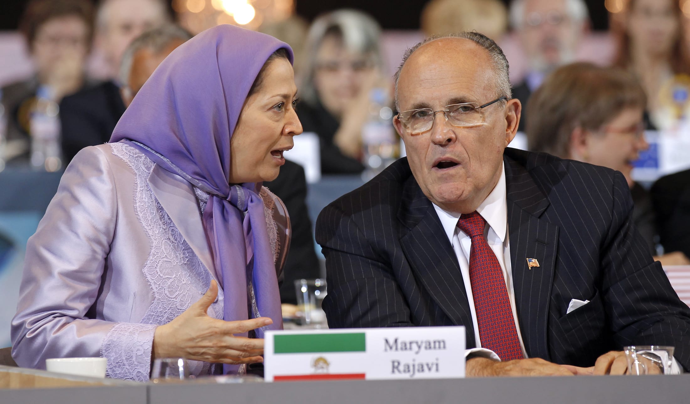 Image Maryam Rajavi, president-elect of the People's Mujahideen Organisation of Iran's (PMOI) political wing, the National Council of Resistance of Iran (NCRI) and former mayor of New York Rudy Giuliani take part in a rally in Villepinte, near Paris June 18, 2011. [REUTERS / Benoit Tessier]