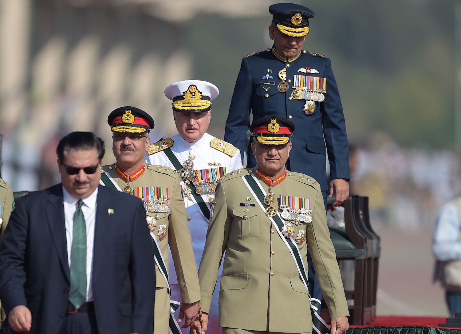 Image [Pakistani Army Chief General Qamar Javed Bajwa (2R), Pakistani Chief of Naval Staff Admiral Zafar Mahmood Abbasi (C), Pakistani Air Chief Marshal Mujahid Anwar Khan (top-R) and Pakistani Chairman of the Joint Chiefs of Staff Committee Zubair Mahmood Hayat (2L) arrive to receive Sri Lankan President Maithripala Sirisena during the Pakistan Day military parade in Islamabad on March 23, 2018. (Photo: Aamir Qureshi / AFP)