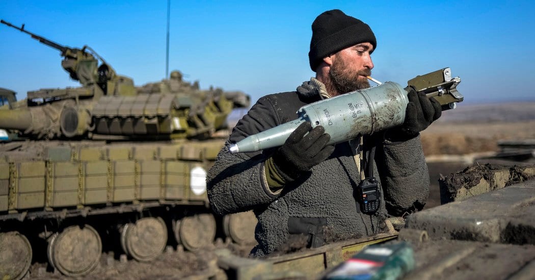 Image [A Ukrainian soldier loads a tank with shells near Donetsk. (Photo: Alexei Chernyshev / Reuters]