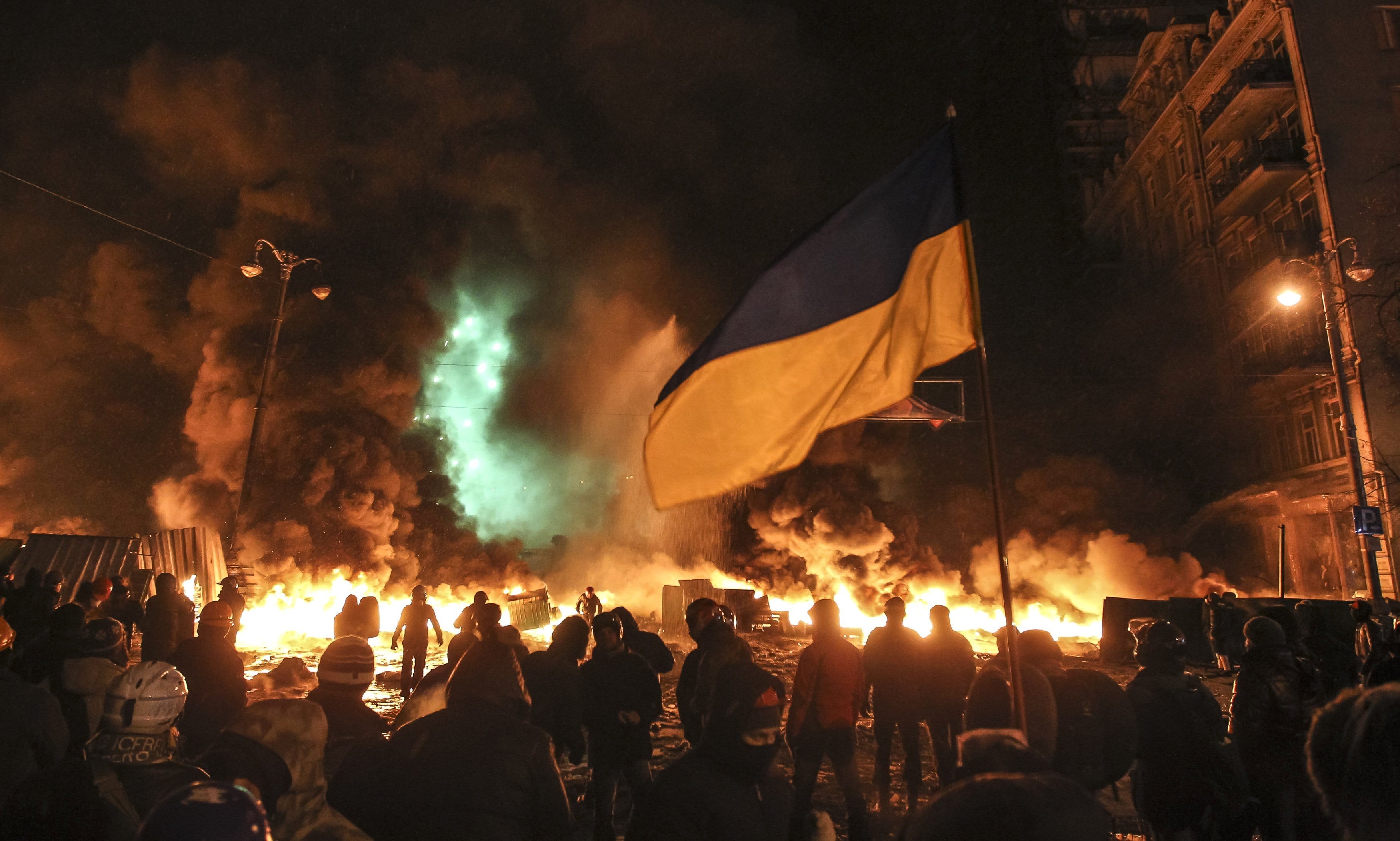 Image [Protesters gather in front of burning tires during clashes with riot police in Kiev, Ukraine, on Jan. 23, 2014. (Photo: Valentyn Ogirenko / Reuters)]