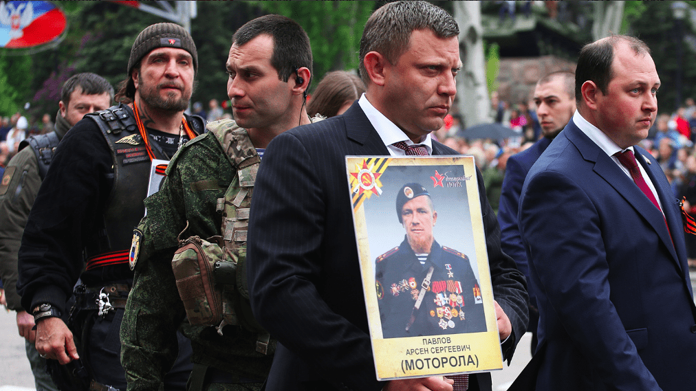 Image [The traditional “Immortal Regiment March”, Donbass, 2017. The event was held under the motto “Legends never die”. Note the presence of the leader of “The Night Wolves” - Alexander Zaldostanov (i.e. “The Surgeon”) behind the late leader of the DNR Alexander Zaharchenko)]