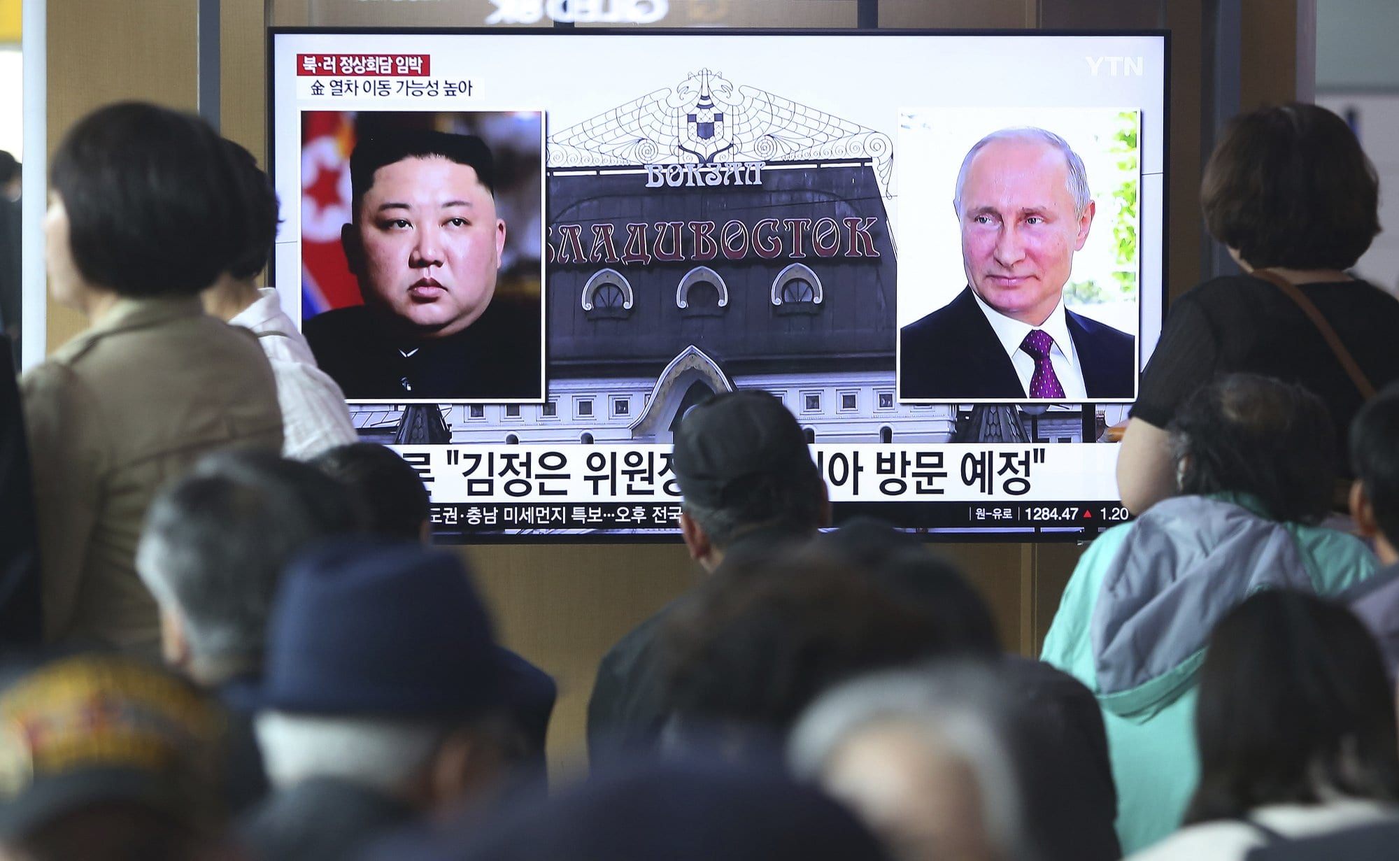 Image [People watch a TV screen showing images of North Korean leader Kim Jong Un and Russian President Vladimir Putin during a news program at the Seoul Railway Station in Seoul, South Korea, days before their summit meeting on April 24-25, 2019. The Korean letters on the screen read, "Kim Jong Un plans to visit Russia ." (Photo Ahn Young-joon / AP)]