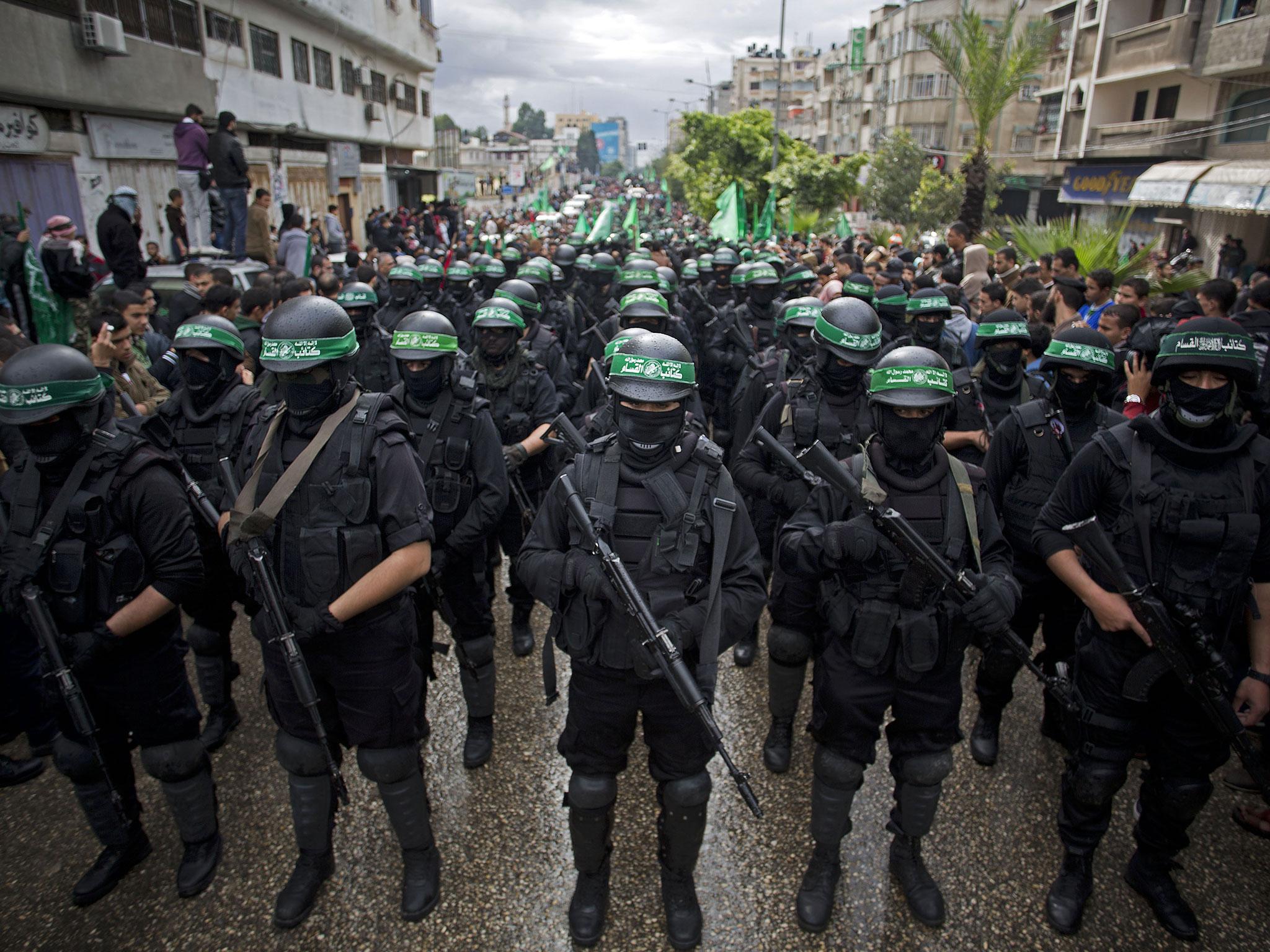 Hamas gunmen display their military skills during a rally to commemorate the 27th anniversary of the militant group ( AP )